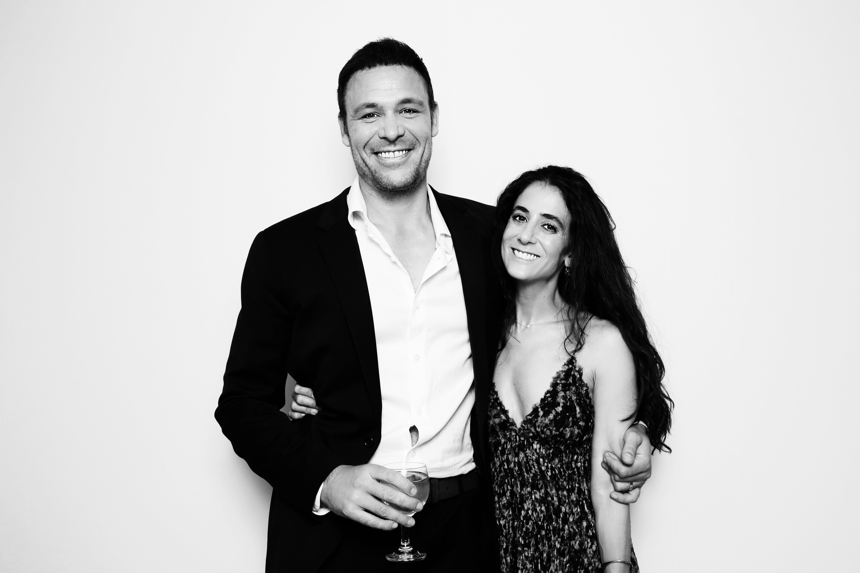 Smiling couple posing in formal wear