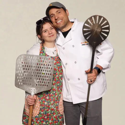 Couple in chef and grillmaster props